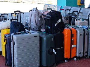 Collection of traveler suitcases and backpacks secured for Athens luggage storage and airport transfer
